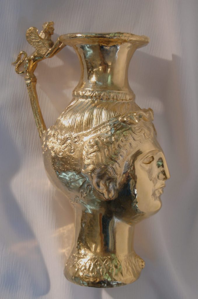 Gilt replica rhyton with female head